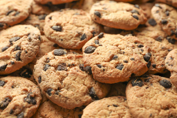 istock Tasty chocolate chip cookies as background 1147585660