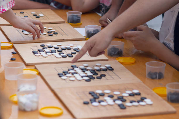 People participate in the go game.  Alphago stock photo