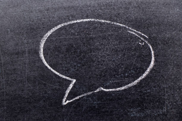 istock White chalk hand drawing in bubble speech shape with blank space for add text on black board background 1147586571