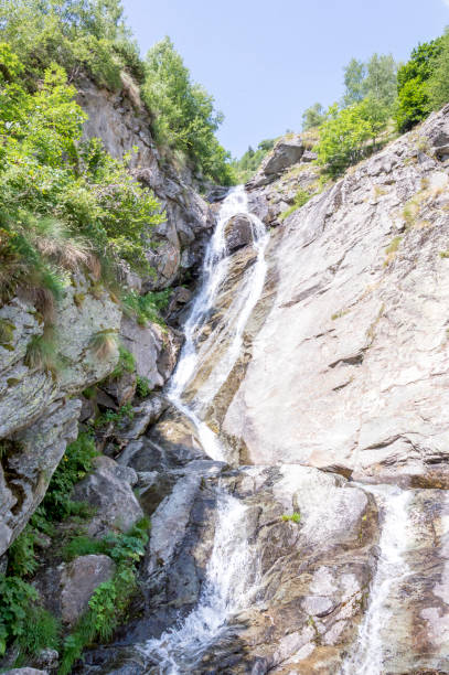 Little waterfall in a wood in the Alps in summer Mount Rose, Monte Rosa in Italian, is the second highest mountain in the Alps. Its name derives from the fact that the south side glaciers are tinged with pink during the last hours of the day in any season. roberto alagna stock pictures, royalty-free photos & images