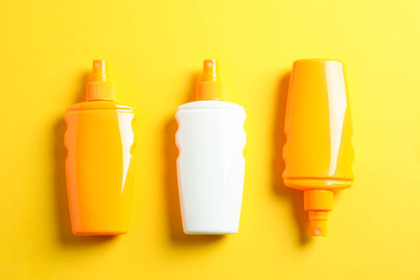 istock Flat lay composition with sunscreen sprays on color background, top view, closeup. Summer vacation 1147592345