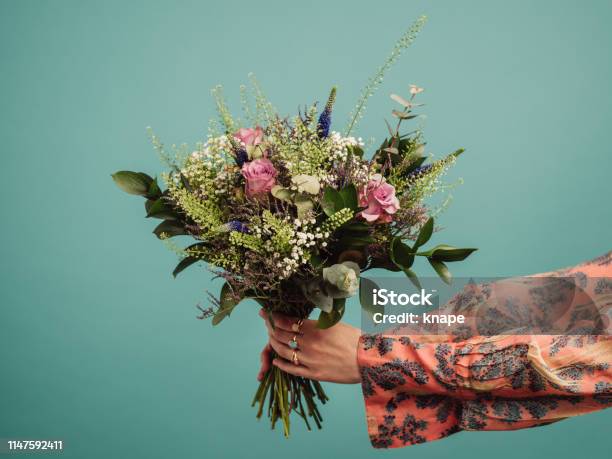 Woman Holding A Big Bouquet Of Flowers Stock Photo - Download Image Now - Flower, Bouquet, Gift
