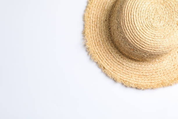 istock Pretty straw hat on white background. Space for text, top view 1147592486
