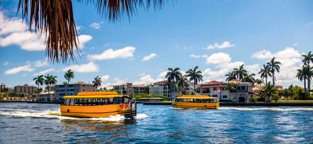 Fort Lauderdale Water Taxis crossing on the Intracoastal waterway Fort Lauderdale Water Taxis crossing on the Intracoastal waterway watertaxi stock pictures, royalty-free photos & images