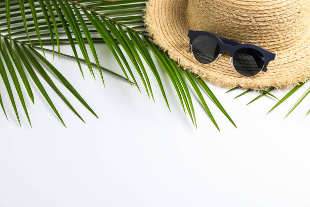 istock Composition with straw hat, sunglasses and palm leaves on white background. Top view, space for text 1147592892