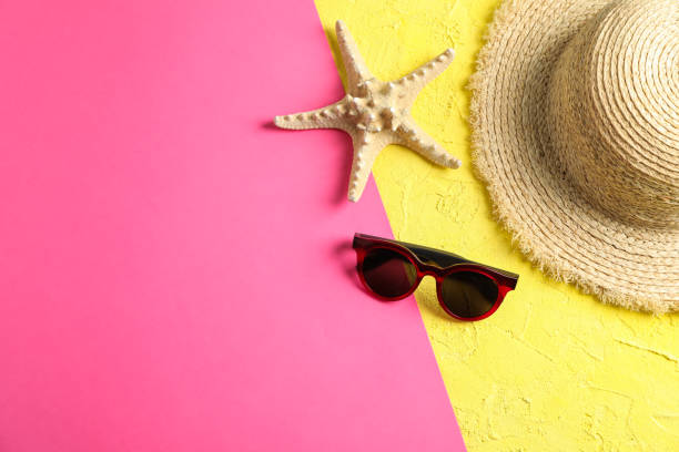 istock Composition with straw hat, sunglasses and starfish on two tone background, space for text 1147592902