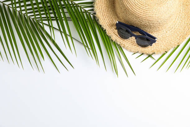 istock Composition with straw hat, sunglasses and palm leaves on white background. Top view, space for text 1147592903