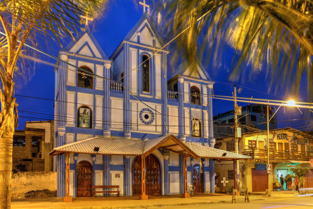 Montanita, Ecuador - June 26, 2018: Night view of the Montanita village curch in Ecuador. Montanita is a surfing resort town on the Pacific cost. Church in the little fishing village and surfing town of Montanita, considered to have the best surfing location in Ecuador montanita ecuador stock pictures, royalty-free photos & images
