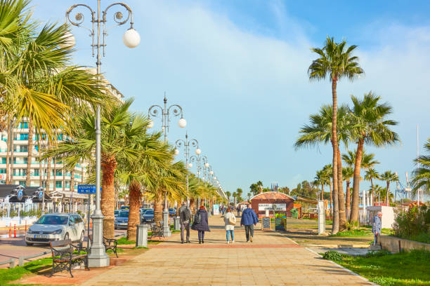 Larnaca, Cyprus - January 28, 2019: Promenade next to Finikoudes beach with walking people in Larnaca