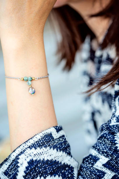 istock Female wrist wearing tiny jewelry bracelet 1147594254