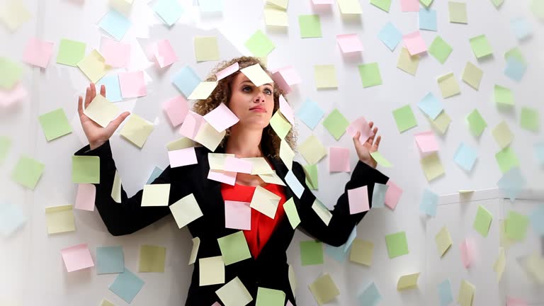 Woman stuck to wall with notes