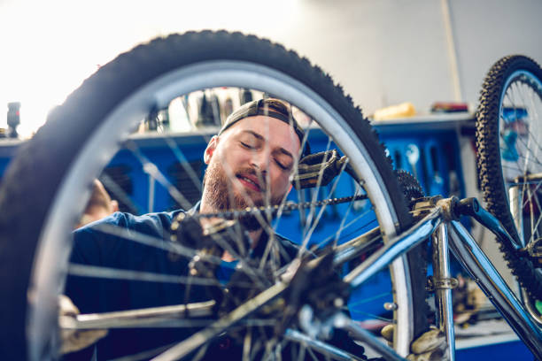 istock Smiling Mechanic Adjusting Bike Gears 1147599628