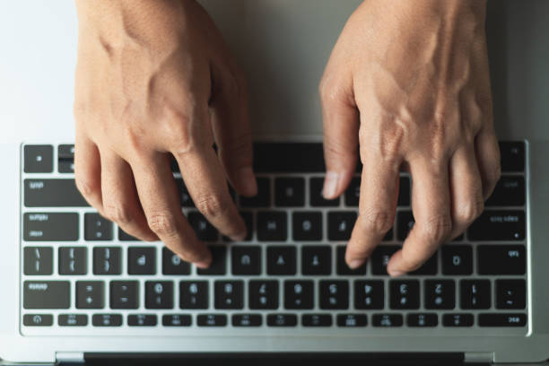 istock Close up hands typing a button on the laptop 1147599884