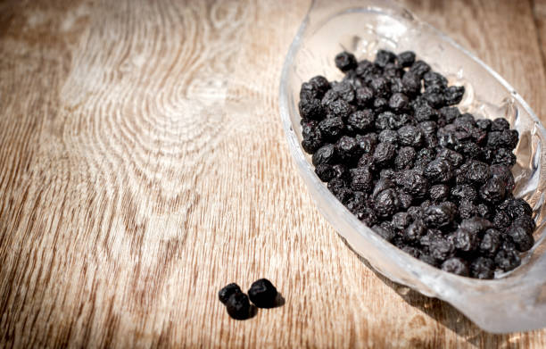 istock Dry, dried chockecherry (chokeberry) - aronia in bowl on rustic table 1147602331