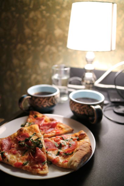 istock Homemade dinner with pizza and tea at home 1147604833