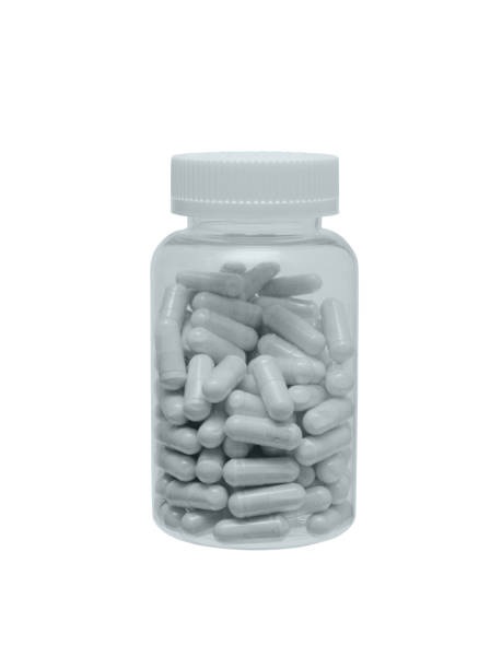 istock The closed plastic small bottle with capsules on a white background 1147610242
