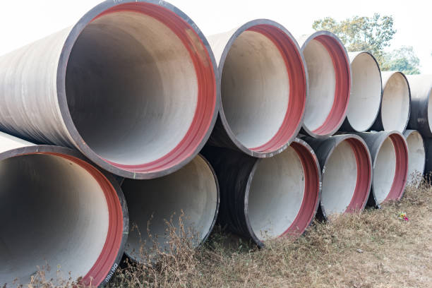 side view of ductile iron pipes stored in open space store yard. stock photo