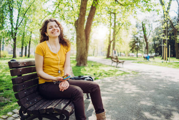 istock Listening to music in a park 1147611936