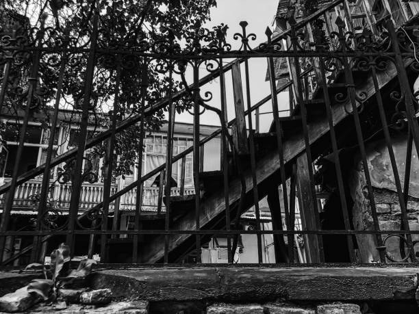 istock Old Tbilisi architecture, yard, windows, old iron stairs in summer day 1147613330