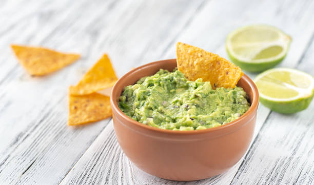 istock Bowl of guacamole with tortilla chips 1147614514