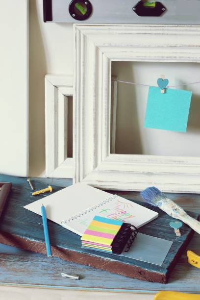 istock Tools, frame, notebook, congratulation on a wooden table, top view, father's day 1147615055