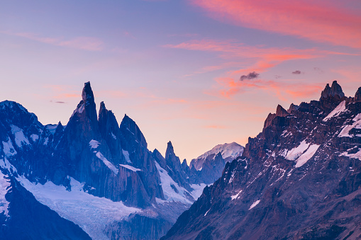 Mount Fitz Roy and Cerro Torre mountain peaks at sunset in Los Glaciares National Park