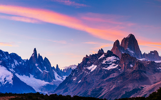 Mount Fitz Roy and Cerro Torre mountain peaks at sunset in Los Glaciares National Park