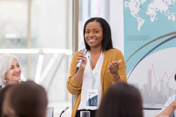 istock Attractive African American speaker answers question 1147616049