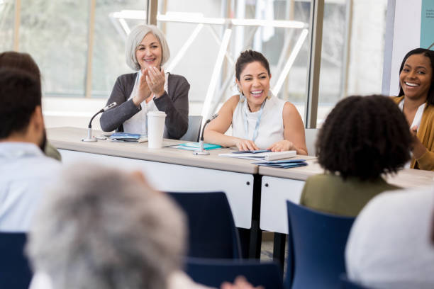 istock Ladies seminar panelists enjoy audience comments 1147616064