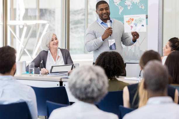 istock Mid adult man displays chart 1147616088