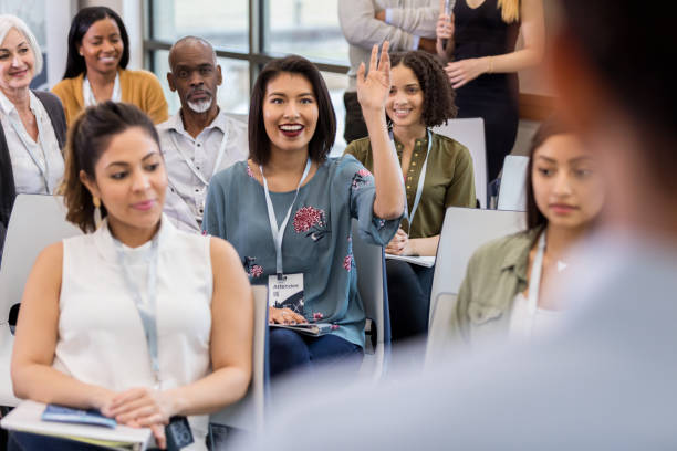 istock Multi-ethnic audience at library town hall meeting 1147616099