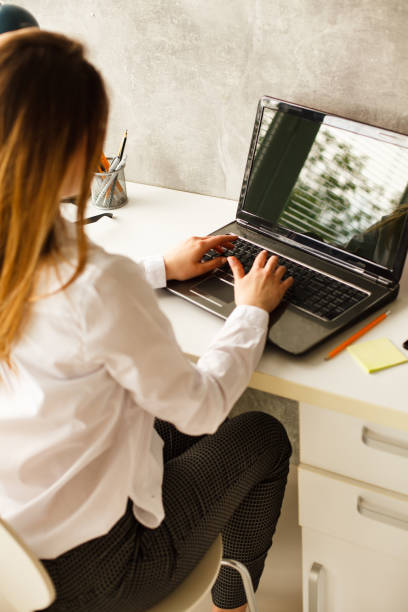 istock Young woman working at home 1147617224