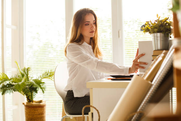 istock A girl working in home office 1147617231
