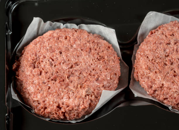 istock Close up of plant based burger patties before cooking 1147617335