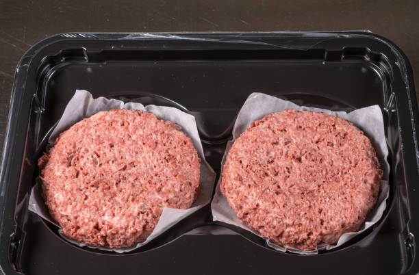 istock Close up of plant based burger patties before cooking 1147617387