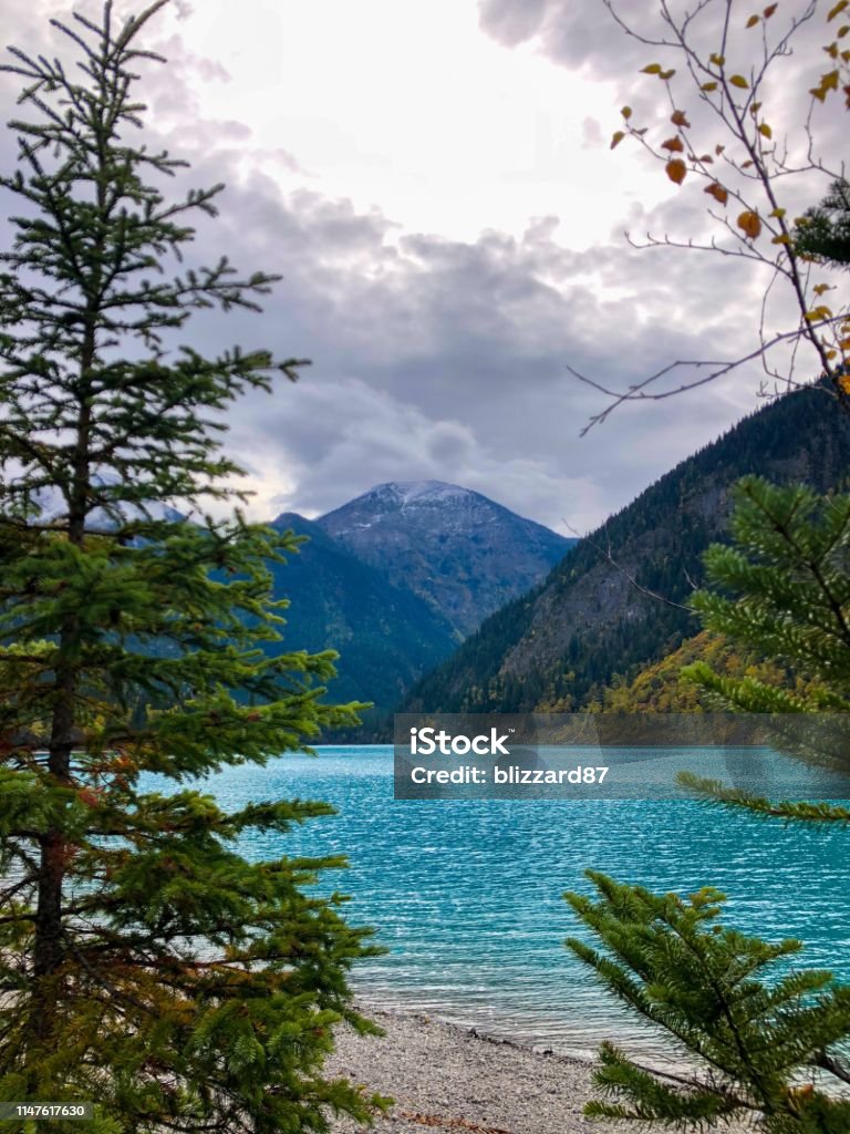 Kinney Lake View on beautiful Kinney Lake in Canada. The blue / turquoise water runs down from the glaciers of Mount Robson. Autumn Stock Photo