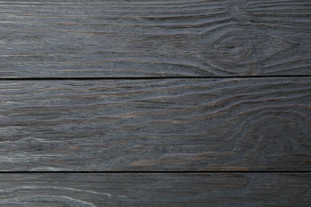 istock Dark wooden background. Space for text, closeup 1147628948