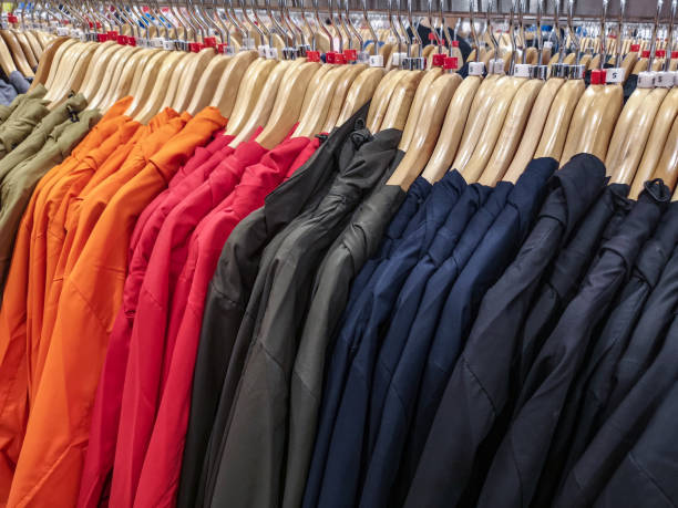 istock row of light jacket clothes on hanger in shop 1147629011