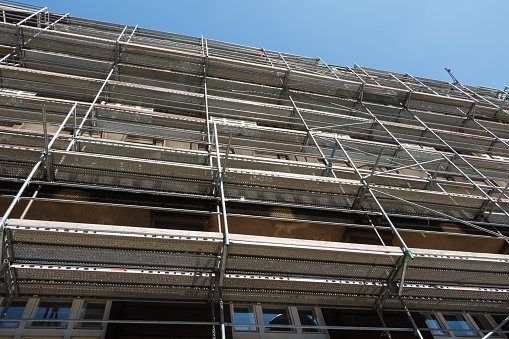 Scaffolding on the facade of a building in renovation