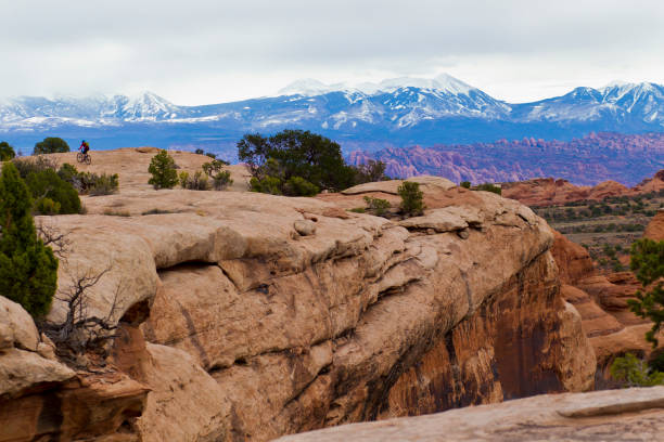 Moab Rocks Mountain Bike Race A male cyclist competes in the Moab Rocks mountain bike race near Moab, Utah, USA on March 27, 2017. Moab Rocks is a three-day cross-country mountain bike stage race. (John Gibson Photo/Gibson Pictures) la sal mountains stock pictures, royalty-free photos & images