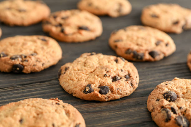 istock Chocolate chip cookies on wooden background 1147633054