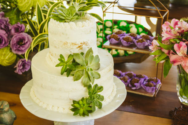 istock Wedding Setup. Cake tables with sweet, decoration and flowers 1147634616