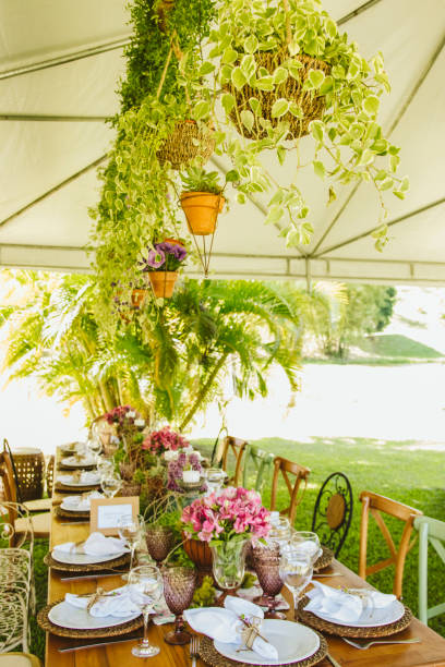 istock Wedding Setup. Banquet with table and chairs. Decoration, flowers, ware, glass 1147634813