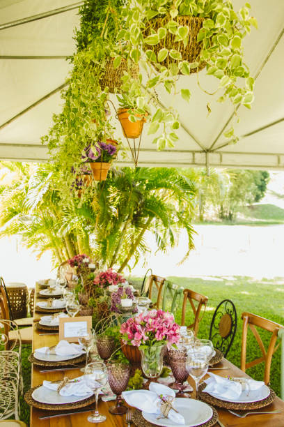 istock Wedding Setup. Banquet with table and chairs. Decoration, flowers, ware, glass 1147634856