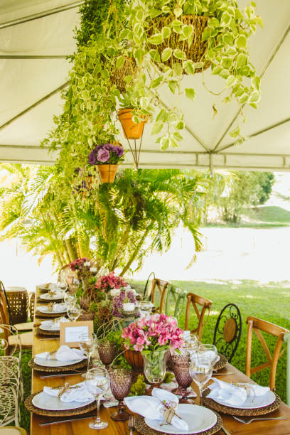istock Wedding Setup. Banquet with table and chairs. Decoration, flowers, ware, glass 1147635753