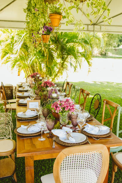 istock Wedding Setup. Banquet with table and chairs. Decoration, flowers, ware, glass 1147635759