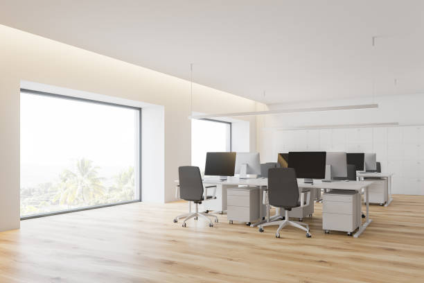 istock Corner of open space office with windows 1147637025