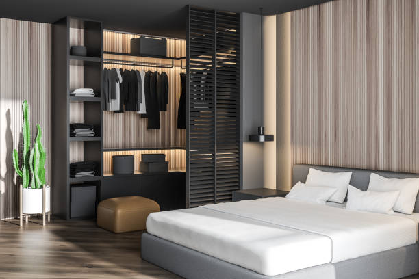 istock Wooden master bedroom with gray wardrobe 1147638138