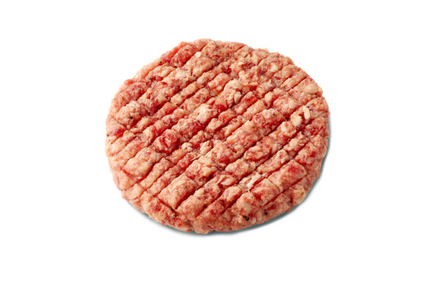 istock Raw beef patty for burger on white background 1147638285