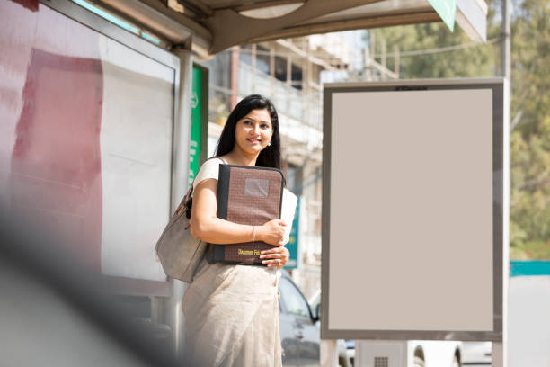 Businesswoman Waiting for the Transport Indian, Bus stop, waiting, travel, employee, Travel, Transport, Delhi, bus shelter stock pictures, royalty-free photos & images